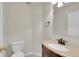 Powder bathroom featuring a vanity with a light granite top at 11091 Clayton St, Northglenn, CO 80233