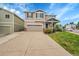 Charming two-story home with a well-manicured lawn and beautiful landscaping at 11091 Clayton St, Northglenn, CO 80233