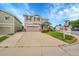 Charming two-story home with a well-manicured lawn and beautiful landscaping at 11091 Clayton St, Northglenn, CO 80233