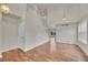 Spacious living room with hardwood floors and a staircase leading to the upper level at 11091 Clayton St, Northglenn, CO 80233