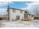 Back of the home featuring a nice-sized fenced yard, deck, patio, and updated exterior at 11278 Clermont Dr, Thornton, CO 80233