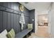 Charming mudroom with bench seating and coat hooks leads into a brightly lit interior at 11278 Clermont Dr, Thornton, CO 80233