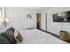 This bedroom includes neutral walls, hardwood floors, and a view to the dining area at 18391 E Kepner Pl # 205, Aurora, CO 80017