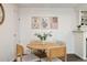 Cozy dining area featuring a modern round table and stylish decor at 18391 E Kepner Pl # 205, Aurora, CO 80017