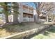 Charming condo exterior featuring multiple balconies and a well-maintained lawn at 18391 E Kepner Pl # 205, Aurora, CO 80017