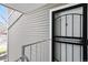 Inviting front door with black security gate, enhancing privacy and style for a secure entrance at 18391 E Kepner Pl # 205, Aurora, CO 80017