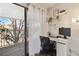 Functional home office with a computer, a desk, and access to the balcony at 18391 E Kepner Pl # 205, Aurora, CO 80017