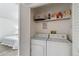 A bright laundry room with a washer and dryer at 18391 E Kepner Pl # 205, Aurora, CO 80017