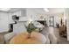 Open concept living space with a kitchen, a dining area, and a comfortable living room at 18391 E Kepner Pl # 205, Aurora, CO 80017