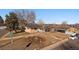 Aerial view of ranch house on corner lot, street view and landscaping visible at 2753 S Meade St, Denver, CO 80236