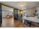 Home office with view into living room and hardwood floors at 2753 S Meade St, Denver, CO 80236