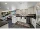 Modern kitchen with stainless steel appliances and farmhouse sink at 2753 S Meade St, Denver, CO 80236