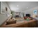 Open concept living room with hardwood floors and dining area at 2753 S Meade St, Denver, CO 80236