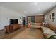 Spacious living room featuring hardwood floors and a leather couch at 2753 S Meade St, Denver, CO 80236