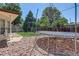 Spacious backyard with a trampoline, swing set, and ample room for outdoor activities at 233 Nome St, Aurora, CO 80010