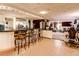 Finished basement offers a full bar with seating and views of the lounge area at 233 Nome St, Aurora, CO 80010