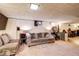Finished basement offers a comfortable lounge area with a wet bar nearby at 233 Nome St, Aurora, CO 80010