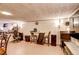 Finished basement area has tile floors, bar seating, game table, and extra lighting at 233 Nome St, Aurora, CO 80010