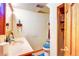 Functional bathroom featuring a vanity, toilet, shower, and necessary fixtures for daily hygiene at 233 Nome St, Aurora, CO 80010