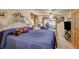 Inviting bedroom featuring plush carpeting, a ceiling fan, and warm natural light throughout at 233 Nome St, Aurora, CO 80010