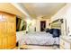The bedroom features a comfortable bed, closet, and dresser with TV at 233 Nome St, Aurora, CO 80010