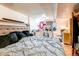 This bedroom features a large bed, closet, and dresser at 233 Nome St, Aurora, CO 80010