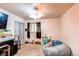 Neutral bedroom with a closet, ceiling fan and dark drapes at 233 Nome St, Aurora, CO 80010