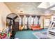 Spacious bonus room or bedroom with a large fan and multiple windows at 233 Nome St, Aurora, CO 80010