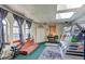 Large bonus room with skylights, bunkbeds, and a cozy lounge area perfect for entertaining at 233 Nome St, Aurora, CO 80010