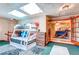 Bonus Room with bunk beds and exterior access via french doors at 233 Nome St, Aurora, CO 80010
