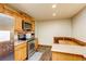 Functional kitchen with wooden cabinets, stainless steel appliances, and a cozy dining nook for everyday living at 233 Nome St, Aurora, CO 80010