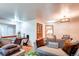 Bright living room with hardwood floors, stylish furniture, and ambient lighting offers a welcoming space at 233 Nome St, Aurora, CO 80010