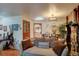 Spacious living room showcasing decor with views into the dining and kitchen spaces at 233 Nome St, Aurora, CO 80010