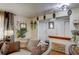 Comfortable living area with stylish decor elements, neutral walls, and hardwood floors at 233 Nome St, Aurora, CO 80010