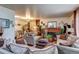 Cozy living room with comfortable sofas, a brick fireplace, and elegant decor at 233 Nome St, Aurora, CO 80010