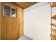Unfinished basement area featuring small windows and wood detailing for added storage at 1185 Yank St, Golden, CO 80401