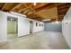 Unfinished basement featuring exposed rafters and white walls with a concrete floor at 1185 Yank St, Golden, CO 80401