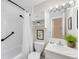 Clean bathroom with a shower-tub combo, white vanity, and updated fixtures at 1185 Yank St, Golden, CO 80401