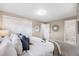 Comfortable main bedroom featuring a bed with stylish pillows and an ensuite bathroom at 1185 Yank St, Golden, CO 80401