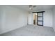 Bedroom featuring carpet and bathroom access with barn door at 460 S Marion Pkwy # 706, Denver, CO 80209