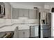 Updated kitchen boasts stainless steel appliances and a farmhouse sink at 460 S Marion Pkwy # 706, Denver, CO 80209