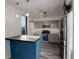 Beautiful kitchen area featuring stainless appliances and a butcher block island at 460 S Marion Pkwy # 706, Denver, CO 80209