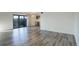 Open living room with bar area and balcony access at 460 S Marion Pkwy # 706, Denver, CO 80209