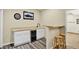 Basement bar area features modern cabinets, wood countertop, wine fridge, and seating at 4649 Spinning Wheel Dr, Brighton, CO 80601