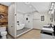 Modern bathroom featuring a soaking tub, walk-in shower, and double sink vanity with black fixtures at 4649 Spinning Wheel Dr, Brighton, CO 80601