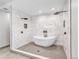 Modern bathroom with a freestanding tub inside a large glass-enclosed shower with dual shower heads at 4649 Spinning Wheel Dr, Brighton, CO 80601