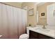Cozy bathroom featuring a white vanity, shower/tub, and neutral wall colors at 4649 Spinning Wheel Dr, Brighton, CO 80601