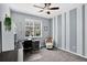 Comfortable bedroom, with grey walls, a ceiling fan, with a desk space and a window that offers a view to the outside at 4649 Spinning Wheel Dr, Brighton, CO 80601