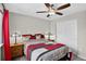 Serene bedroom with neutral color palette, overhead fan, closet with slider doors and lots of light at 4649 Spinning Wheel Dr, Brighton, CO 80601