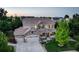 Stunning two-story home featuring a three-car garage, well-manicured lawn, and inviting front porch at 4649 Spinning Wheel Dr, Brighton, CO 80601